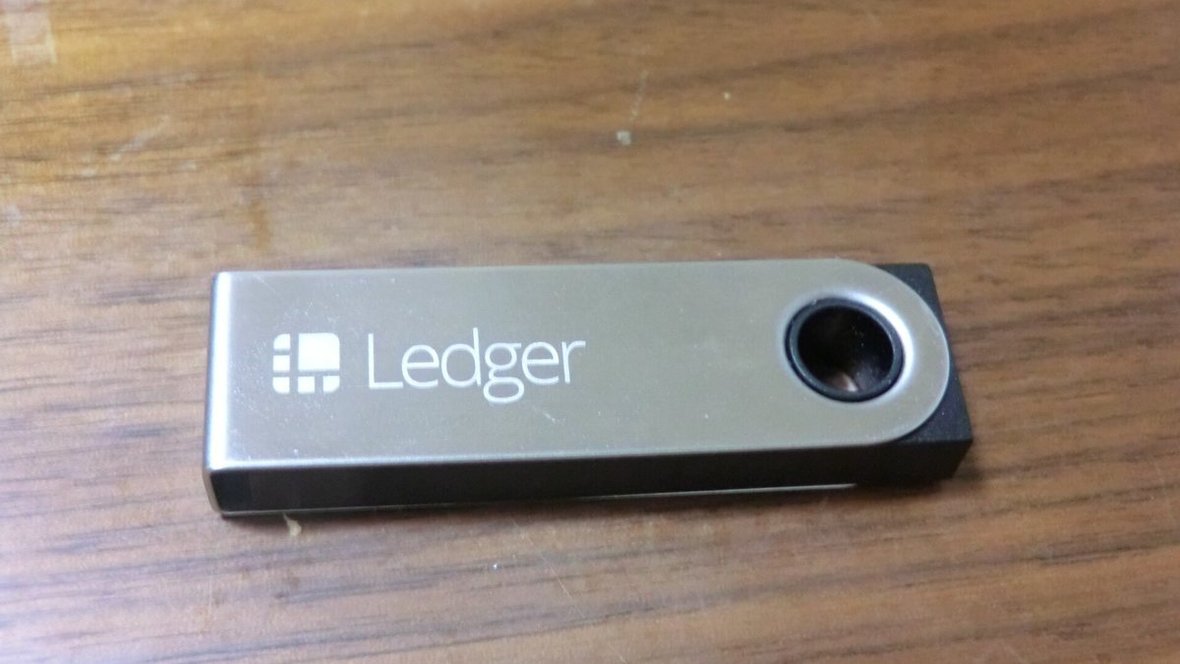 Ledger Nano S hardware wallet on a wooden desk
