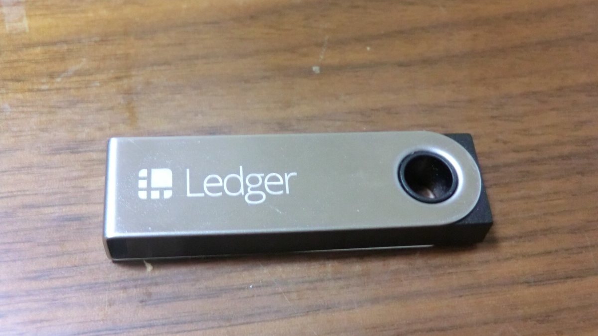 Ledger Nano S hardware wallet on a wooden desk